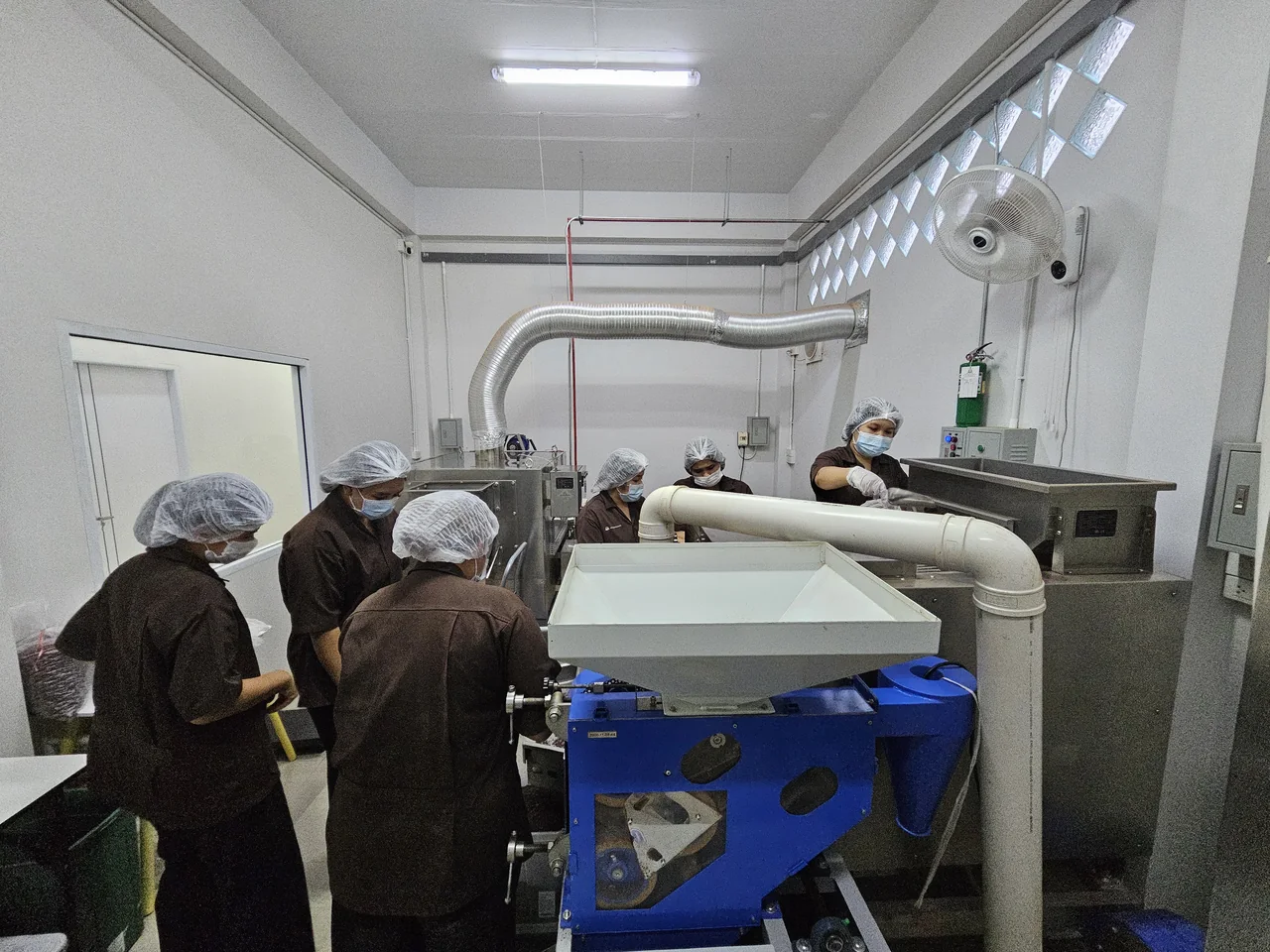 The team working with equipment in the production area.